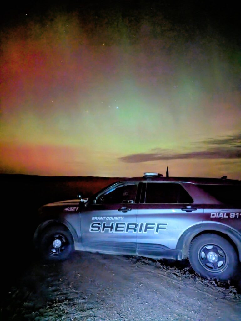 Grant County Sheriffs car with northern lights